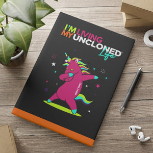 "I'm Living My UnCloned® Life with Dabbing Unicorn"  8.5in x 11in Hardcover Notebook with Puffy Covers